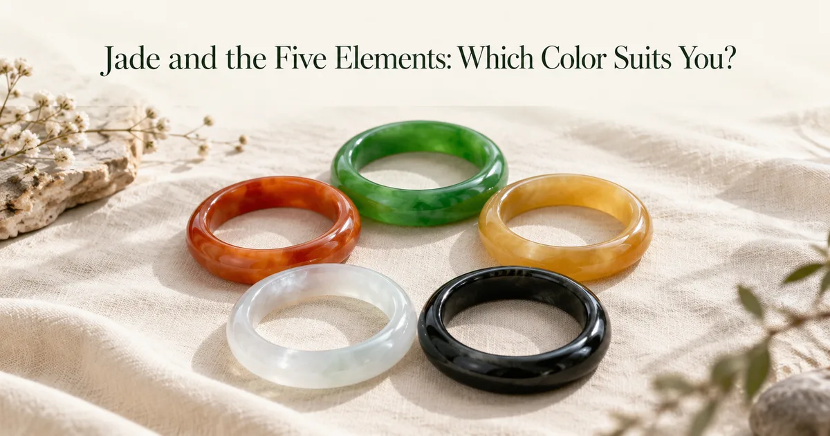 Five jadeite bangles in green, orange-red, honey yellow, icy white and black arranged in a circle on ivory linen, with the title Jade and the Five Elements: Which Color Suits You?